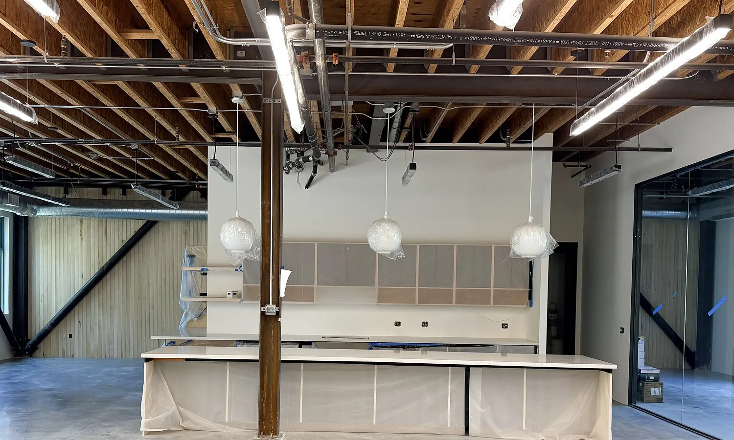 Kitchen and island under pendant lighting at 1447 Cloverfield